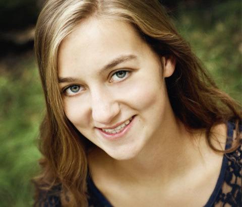 A young woman smiling for the camera.