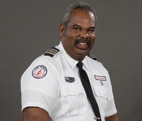 A man in a uniform posing for a photo.