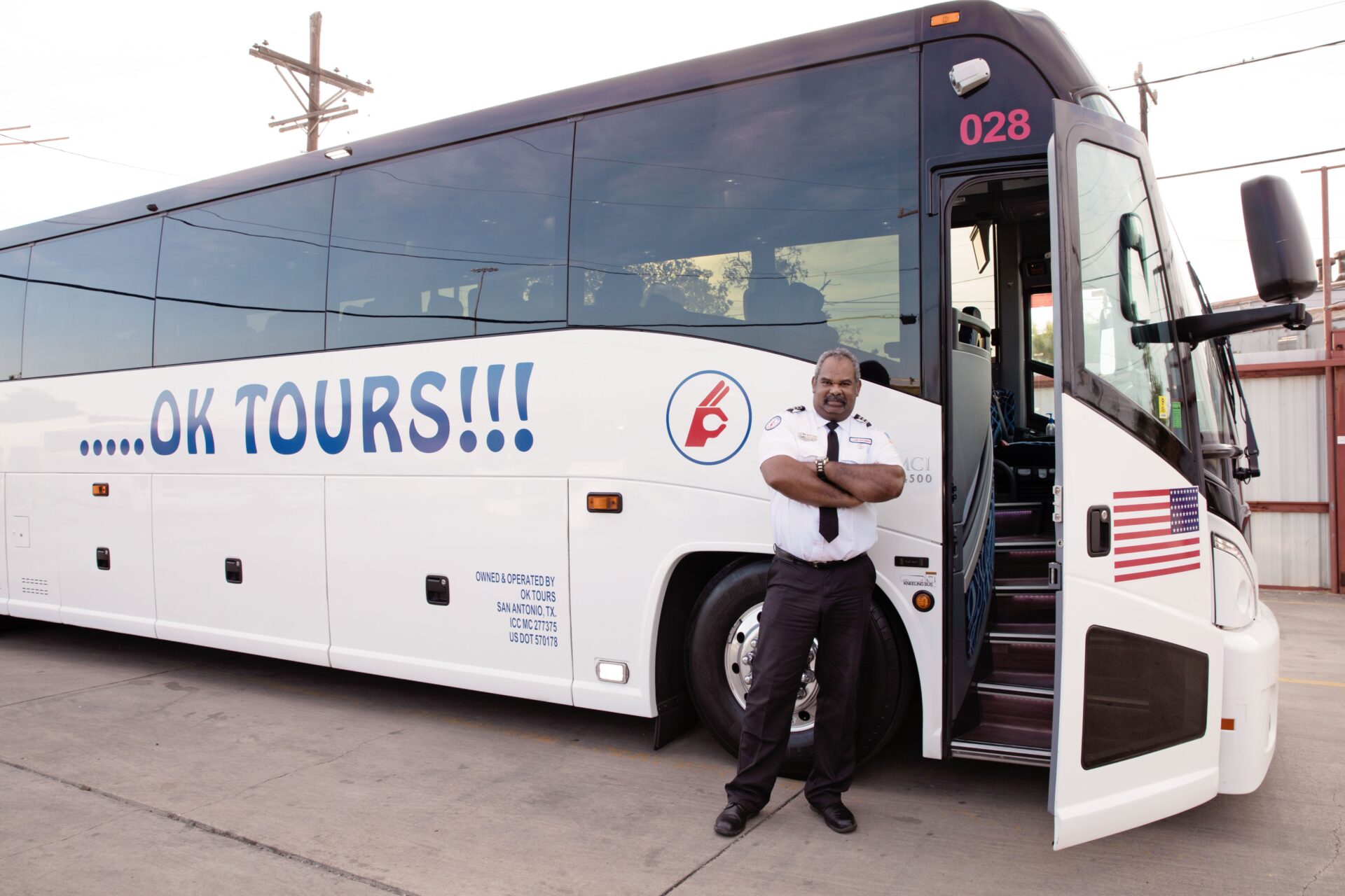 A man standing in front of a bus.