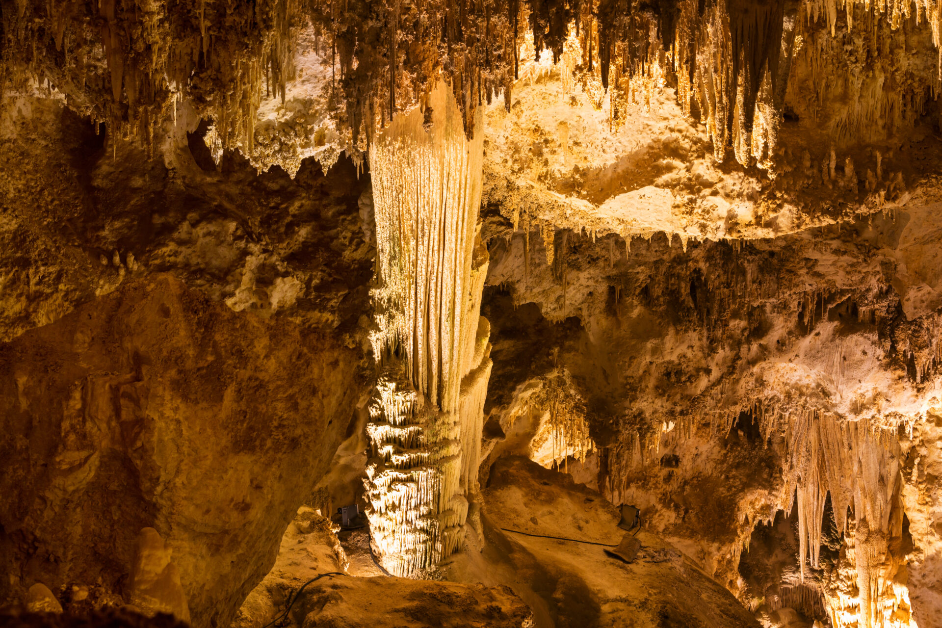 An image of a cave with stalactites and stalagmites.
